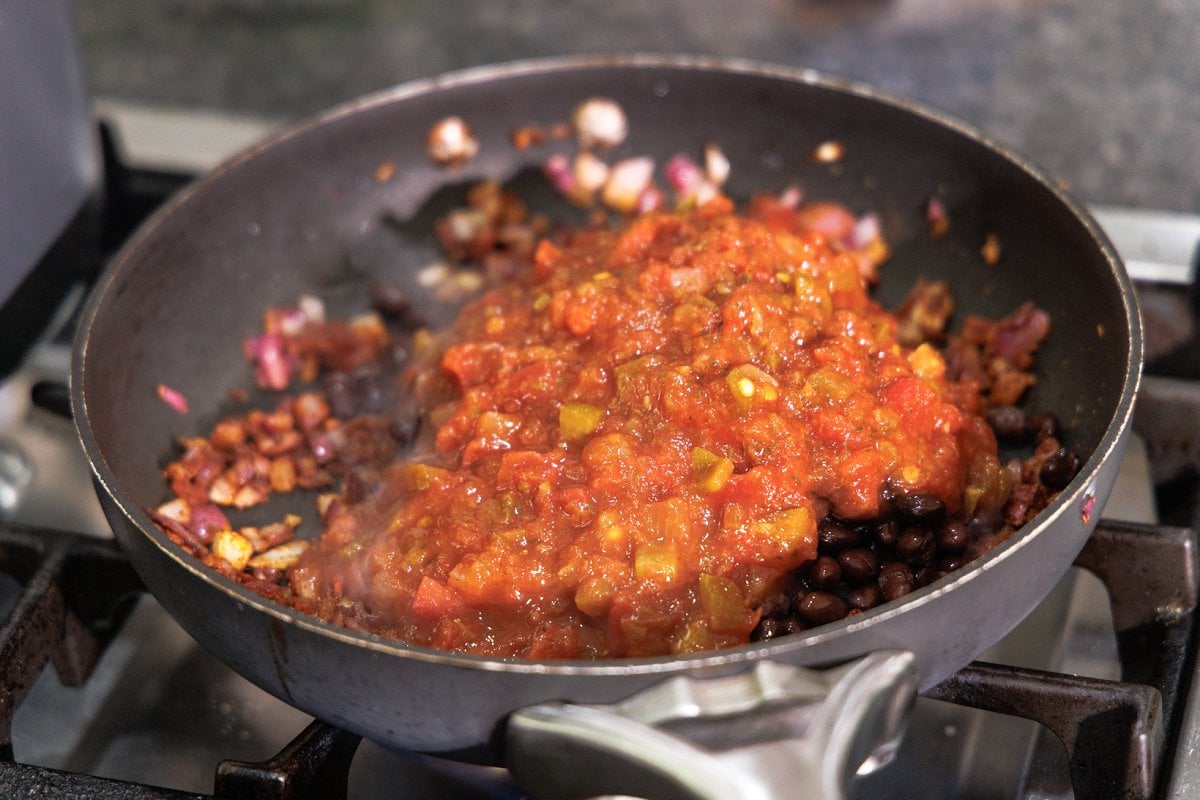 Jarred salsa added to pan.