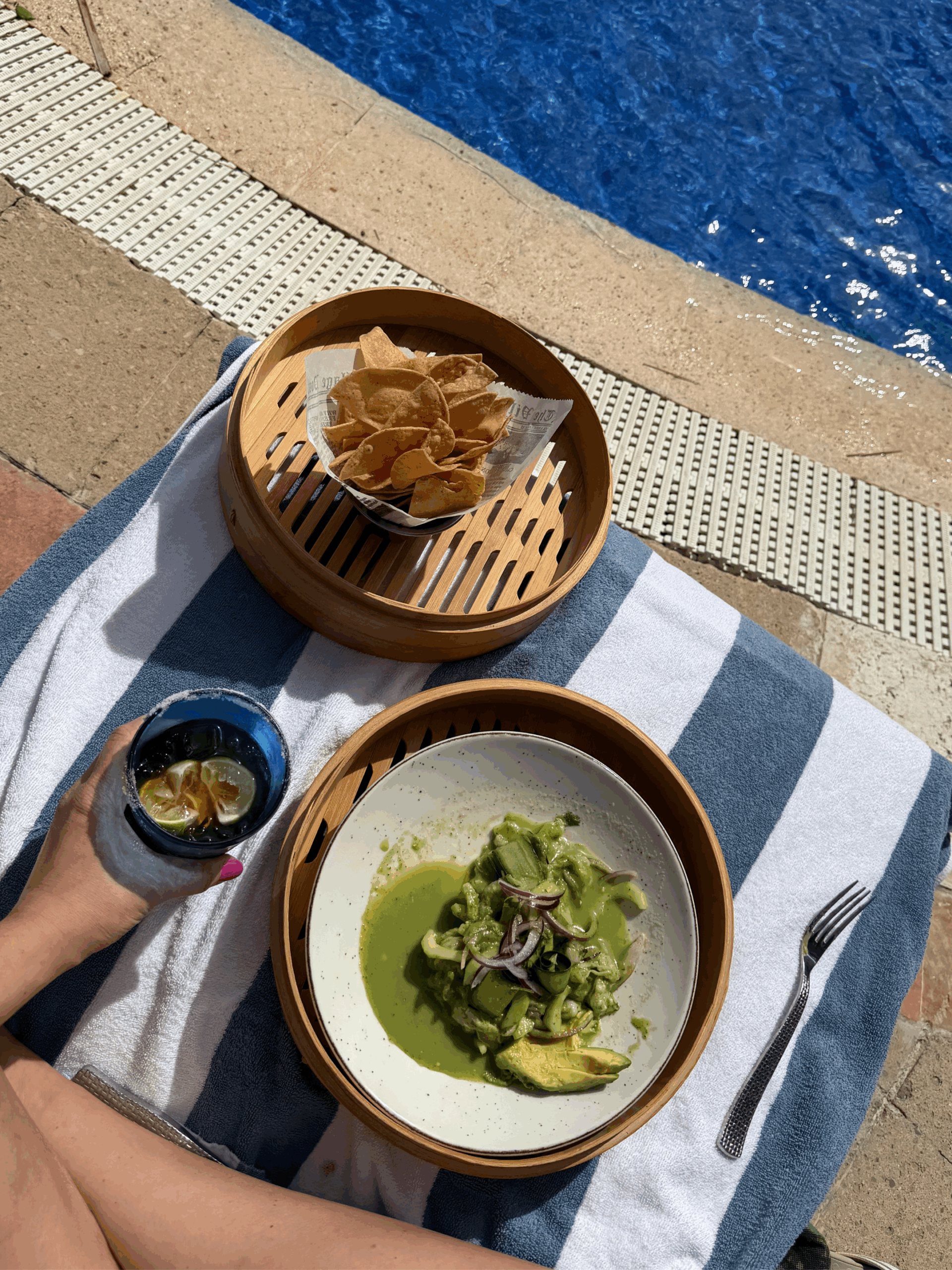 Liz enjoying chips, ceviche, and a drink poolside at the JW Marriott Cancun.