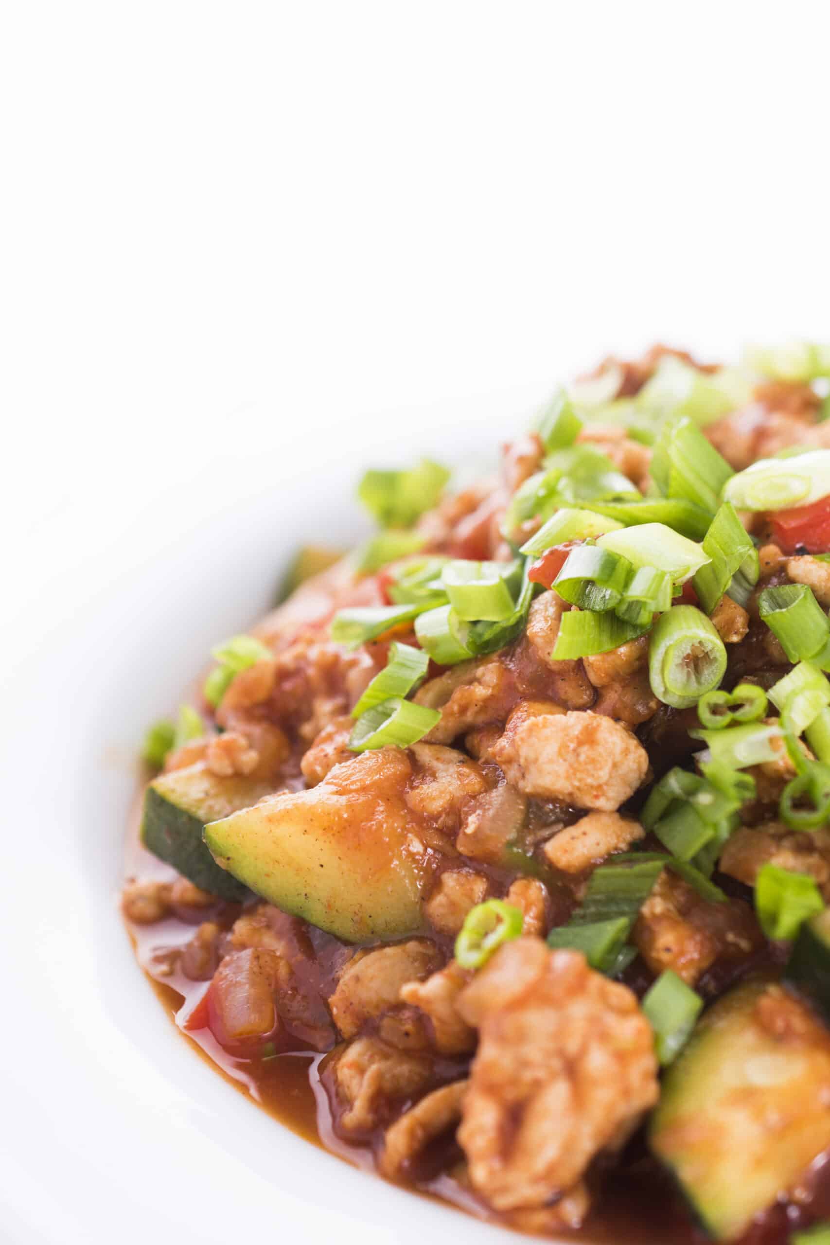 Ground turkey with zucchini topped with fresh scallions.