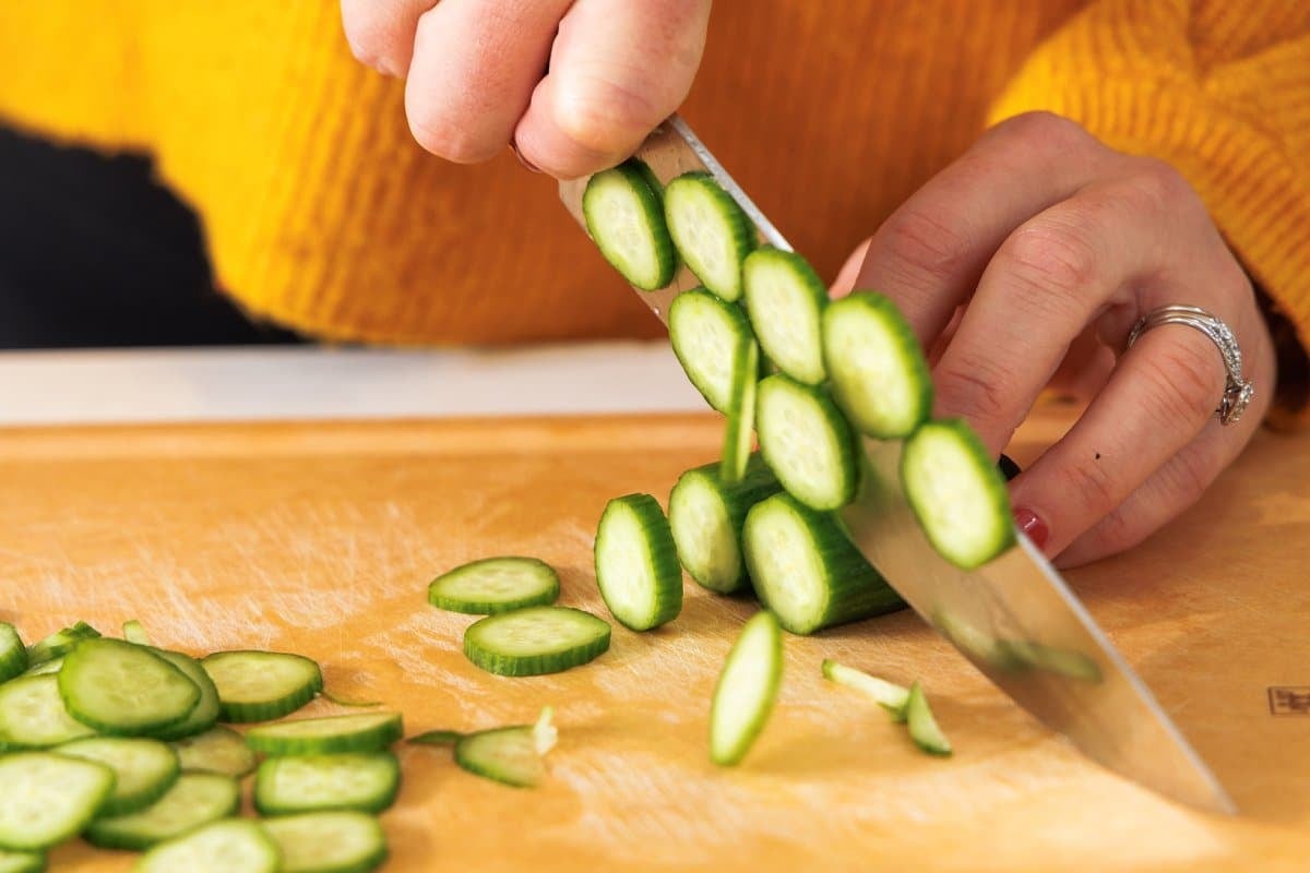 Slicing a cucumber.
