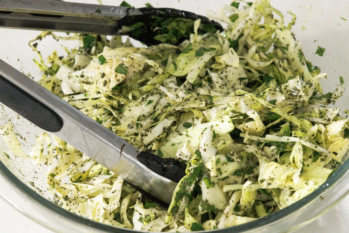 Dried mint and fresh parsley added to shredded cabbage.
